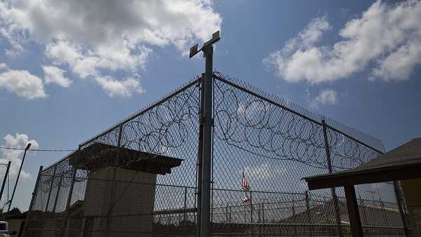 FILE - A fence stands at Elmore Correctional Facility in Elmore, Ala., June 18, 2015. Alabama inmates were in their second day of a work strike Tuesday, Sept. 27, 2022, refusing to labor in prison kitchens, laundries and factories to protest conditions in the state's overcrowded, understaffed lock-ups. (AP Photo/Brynn Anderson, File)