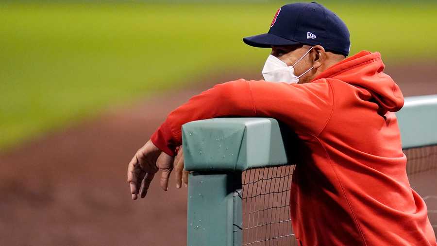 Boston Red Sox manager Alex Cora watches from the dugout during