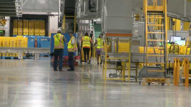 Robots work alongside employees at Amazon facility in Canton