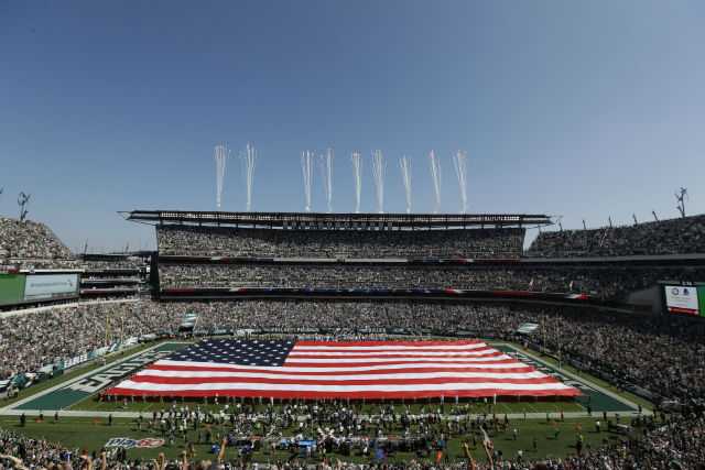 Sports teams celebrate U.S. flag -- even if it violates code