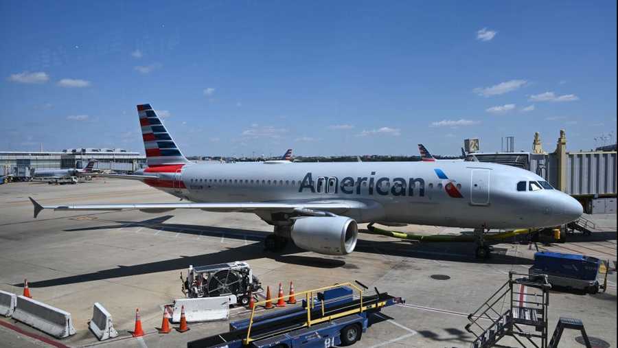 An American Airlines airplane is seen at a gate at Washington National Airport (DCA) on April 11, 2020 in Arlington, Virginia. Many flights are canceled due to the spread of the coronavirus.