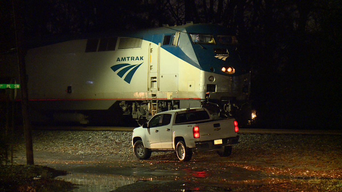 Man and woman killed after their car collides with Amtrak train in ...