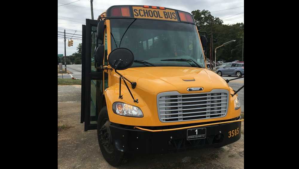 Tractortrailer clips school bus in Anderson on South Murray Street
