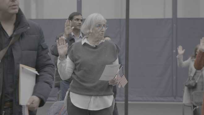 Andra Bucci of Elk Grove swears in during a naturalization ceremony to become a U.S. citizen. Bucci regularly leads tours in Europe to educate others about the Holocaust as a survivor herself.