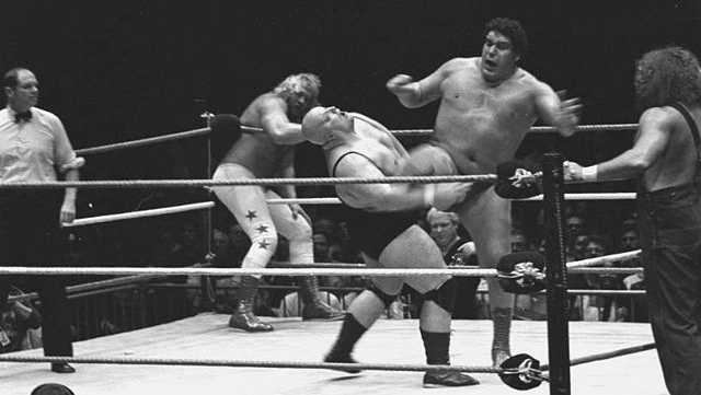 Andre the Giant kicks King Kong Bundy.