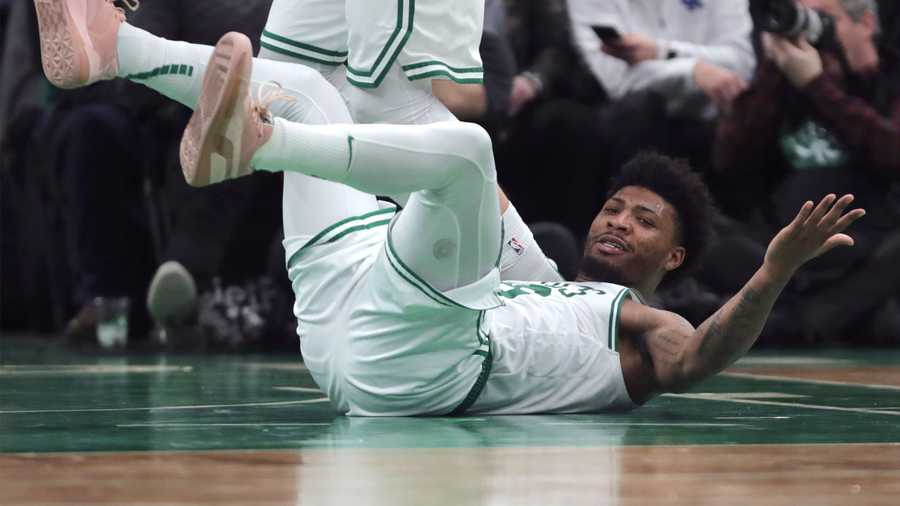 Boston Celtics guard Marcus Smart hits the floor while expecting a foul to be called during the second half of the team's NBA basketball game against the Detroit Pistons in Boston, Wednesday, Jan. 15, 2020. The Pistons won 116-103. (AP Photo/Charles Krupa)