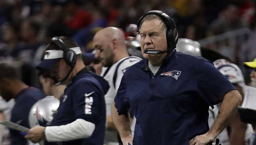 New England Patriots head coach Bill Belichick stands on the field