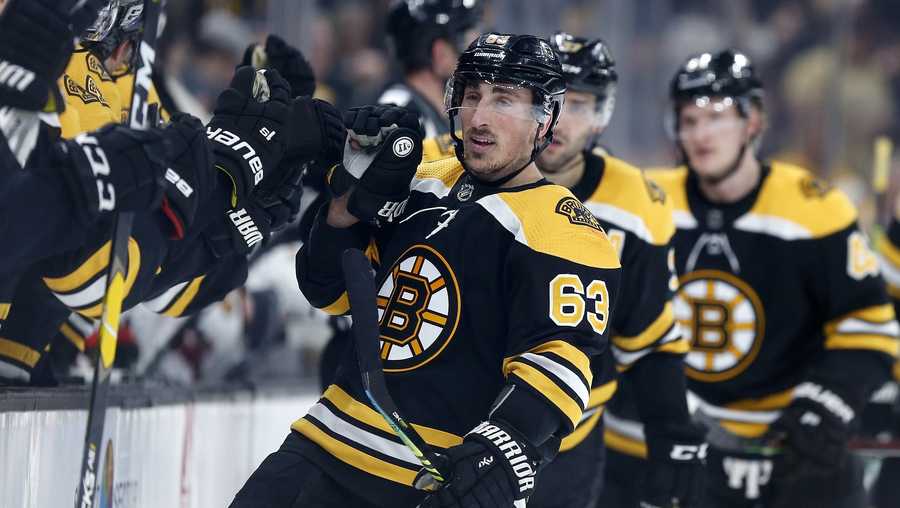 Boston Bruins' Brad Marchand (63) celebrates his goal during the first period of the team's NHL hockey game against the Chicago Blackhawks in Boston, Tuesday, Feb. 12, 2019. (AP Photo/Michael Dwyer)