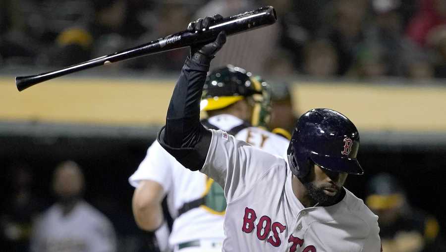 Boston Red Sox's Jackie Bradley Jr. (19) throws his bat after striking out against the Oakland Athletics during the seventh inning of a baseball game in Oakland, Calif., Tuesday, April 2, 2019. (AP Photo/Tony Avelar)