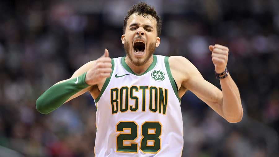 Boston Celtics guard RJ Hunter (28) reacts after he made a 3-point basket during the second half of the team's NBA basketball game against the Washington Wizards, Tuesday, April 9, 2019, in Washington. The Celtics won 116-110. (AP Photo/Nick Wass)