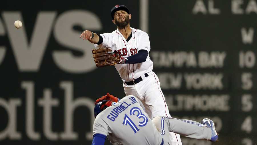 Boston Red Sox second baseman Dustin Pedroia throws to first after forcing out Toronto Blue Jays' Lourdes Gurriel Jr. during the third inning of a baseball game Thursday, April 11, 2019, at Fenway Park in Boston. Socrates Brito was safe at first. (AP Photo/Winslow Townson)