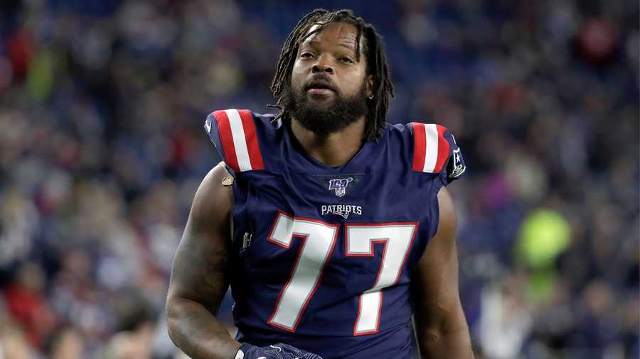 New England Patriots defensive end Michael Bennett warms up before an NFL football game against the New York Giants, Thursday, Oct. 10, 2019, in Foxborough, Mass. (AP Photo/Elise Amendola)