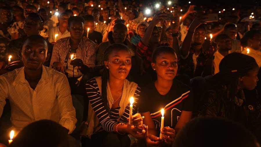 in this sunday, april 7, 2019 file photo, rwandans sitting in the stands hold candles as part of a candlelit vigil during a genocide memorial service held at amahoro stadium in the capital kigali, rwanda felicien kabuga, one of the most wanted fugitives in rwanda's 1994 genocide who had a 5 million bounty on his head, has been arrested in paris, authorities said saturday, may 16, 2020