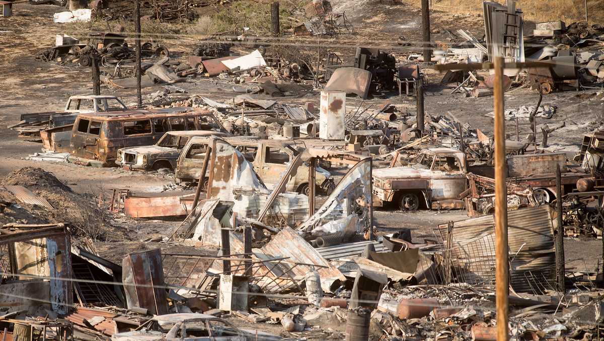 Homes burned by California fire; teams look for more damage