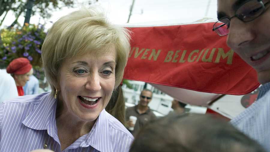 In this Aug. 15, 2012, file photo, Linda McMahon, Republican candidate for U.S. Senate, left, talks with supporter David Becker and his baby daughter Shelby at campaign stop in Fairfield, Conn.  (AP Photo/Jessica Hill, File)