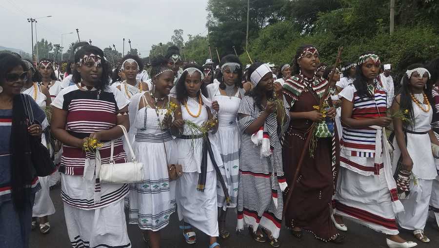 People march during an annual religious festival in Bishoftu, a town southeast of Ethiopia's capital, Addis Ababa, Sunday, Oct. 2, 2016. Several people were crushed to death Sunday morning, according to witnesses, in a stampede after police used tear gas and rubber bullets to disperse protesters chanting anti-government slogans as they pushed toward a stage where leaders were speaking.