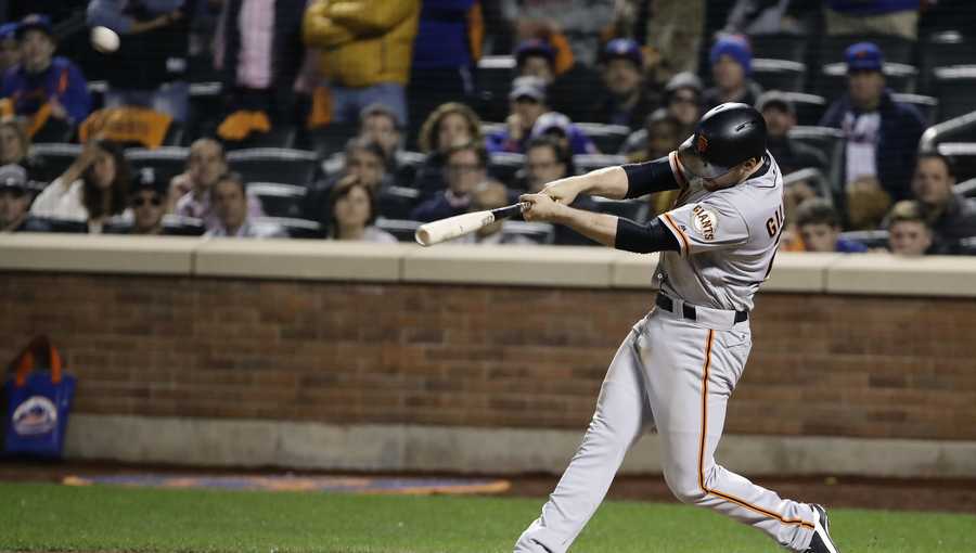 San Francisco Giants' Conor Gillaspie connects for a three-run home run against the San Francisco Giants during the ninth inning of the National League wild-card baseball game, Wednesday, Oct. 5, 2016, in New York. The Giants won 3-0.