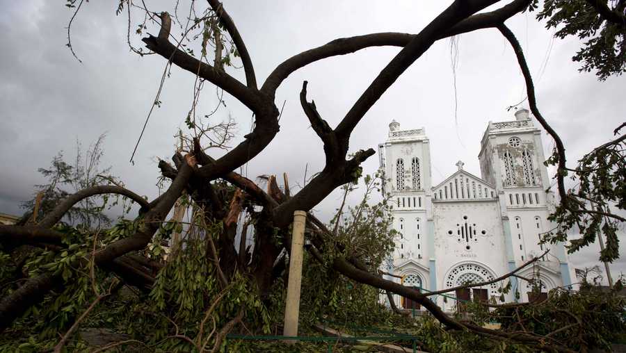 Trees are down outside a damaged church after the passing of Hurricane Matthew in Les Cayes, Haiti, Thursday, Oct. 6, 2016. Two days after the storm rampaged across the country's remote southwestern peninsula, authorities and aid workers still lack a clear picture of what they fear is the country's biggest disaster in years.