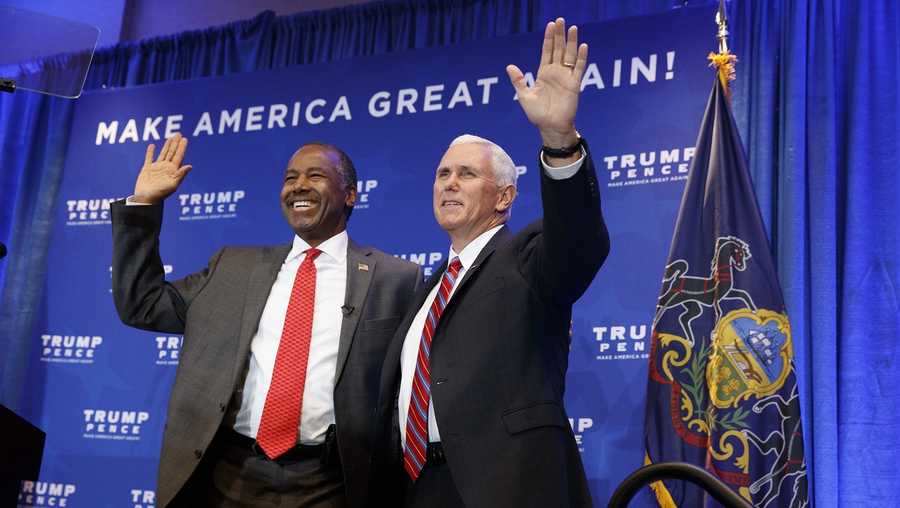 Dr. Ben Carson stands with Republican vice presidential candidate, Indiana Gov. Mike Pence