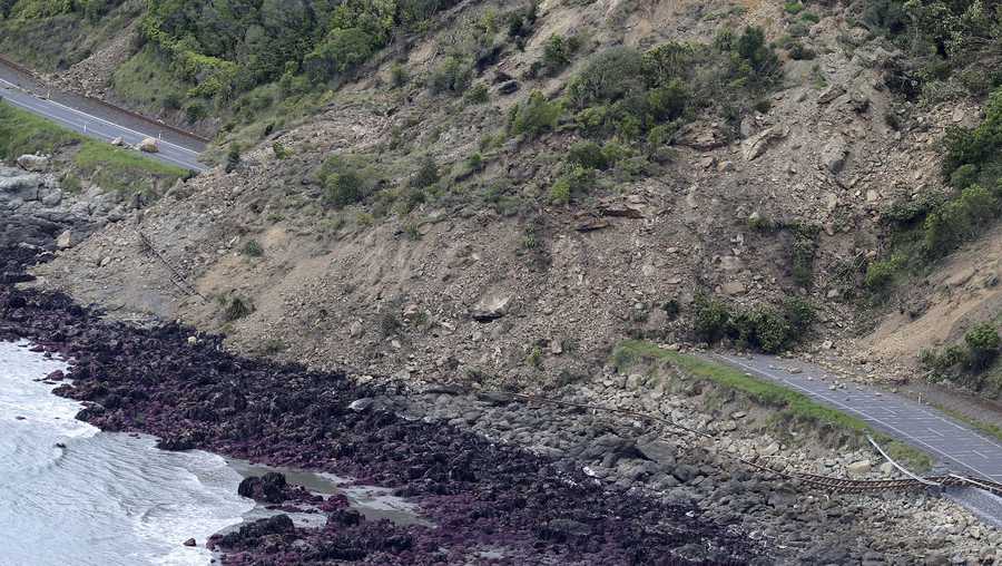 Railway tracks of the main trunk railway line are displaced by a massive landslide that also blocks State Highway One following an earthquake on the coastline, north of Kaikoura, New Zealand Monday, Nov. 14, 2016. A powerful earthquake that rocked New Zealand on Monday triggered landslides and a small tsunami, cracked apart roads and homes and left two people dead, but largely spared the country the devastation it saw five years ago when a deadly earthquake struck the same region.