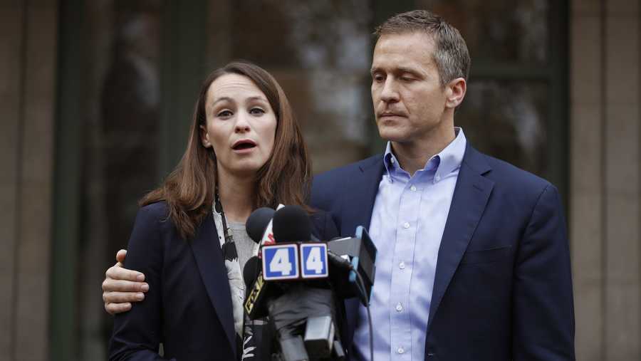 Missouri Gov.-elect Eric Greitens and his wife Sheena speak to the media Tuesday, Dec. 6, 2016, in St. Louis. Sheena Greitens was robbed at gunpoint while sitting in her car on Monday night not far from from the future first family's current St. Louis home. (AP Photo/Jeff Roberson)