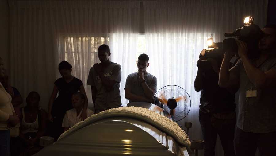Friends and relatives attend a wake for Kansas City Royals pitcher Yordano Ventura, in Las Terrenas, Dominican Republic, Monday, Jan. 23, 2017.