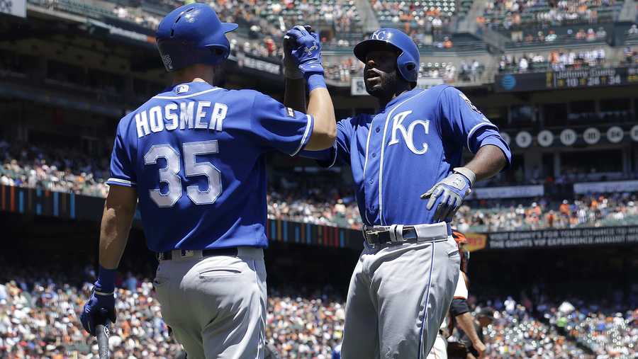 Kansas City Royals' Lorenzo Cain, right, celebrates after hitting a solo home run against the San Francisco Giants with Eric Hosmer during the third inning of a baseball game in San Francisco, Wednesday, June 14, 2017