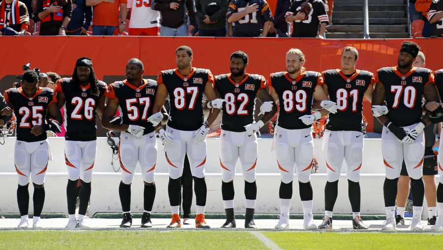 Cincinnati Bengals players lock arms during the national anthem before an NFL football game against the Cleveland Browns, Sunday, Oct. 1, 2017, in Cleveland. (AP Photo/Ron Schwane)
