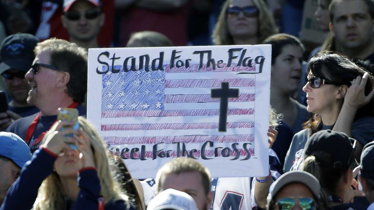 Photos: Patriots stand during national anthem before Panthers game