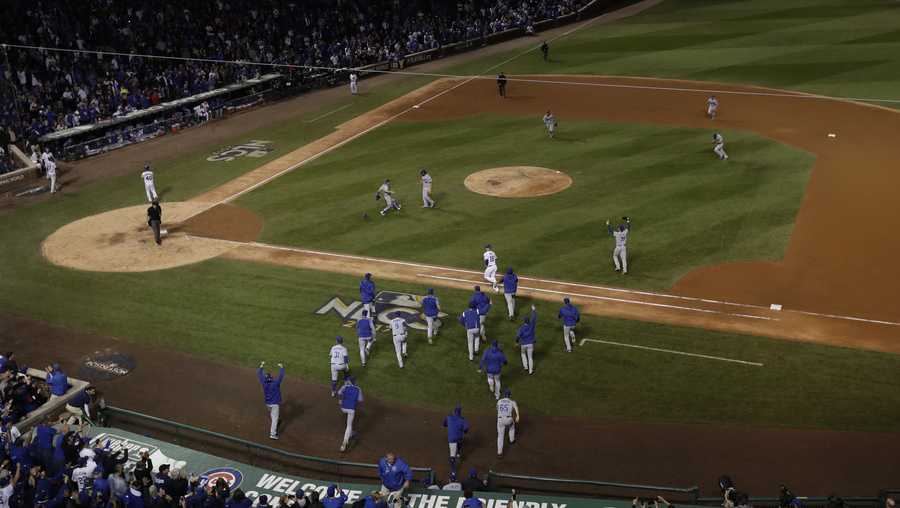 The Los Angeles Dodgers players celebrate after Game 5 of baseball's National League Championship Series against the Chicago Cubs, Thursday, Oct. 19, 2017, in Chicago. The Dodgers won 11-1 to win the series and advance to the World Series. (AP Photo/Matt Slocum)