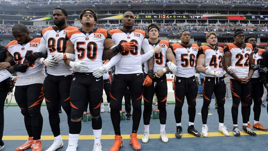 Cincinnati Bengals players stand for the national anthem before an NFL football game against the Tennessee Titans Sunday, Nov. 12, 2017, in Nashville, Tenn. (AP Photo/Mark Zaleski)