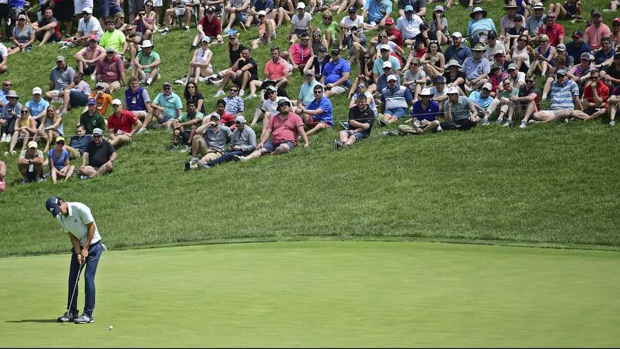 Joaquin Niemann, from Chile, follows his putt on the 17th hole during the final round of the Memorial golf tournament Sunday, June 3, 2018, in Dublin, Ohio. (AP Photo/David Dermer)