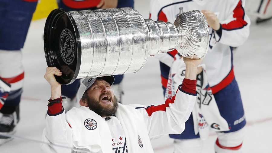 Washington Capitals left wing Alex Ovechkin, of Russia, hoists the Stanley Cup after the Capitals defeated the Vegas Golden Knights 4-3 in Game 5 of the NHL hockey Stanley Cup Finals Thursday, June 7, 2018, in Las Vegas.