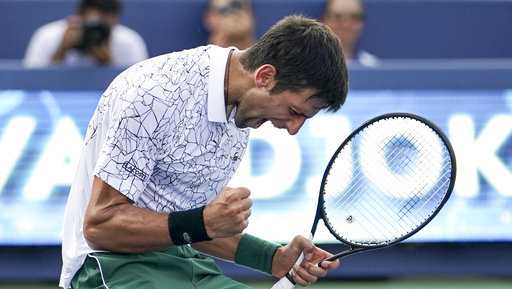Novak Djokovic, of Serbia, reacts after defeating Roger Federer, of Switzerland, during the finals at the Western & Southern Open tennis tournament, Sunday, Aug. 19, 2018, in Mason, Ohio.