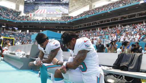 Dolphins players first in NFL to take knee as season begins