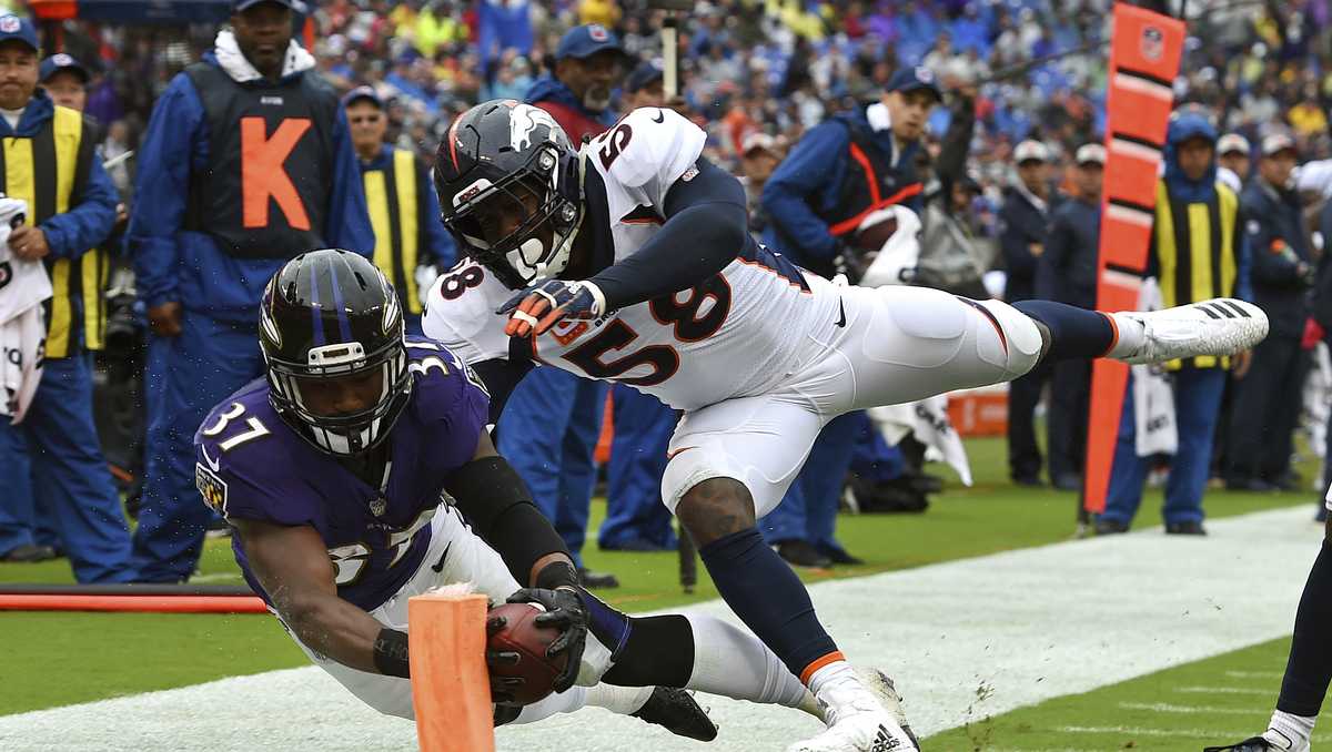 Lindsay ejected as Ravens beat Broncos, 27-14 in wild game