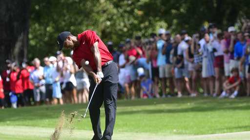 Tiger Woods hits from the fifth fairway during the final round of the Tour Championship golf tournament Sunday, Sept. 23, 2018, in Atlanta. (AP Photo/John Amis)