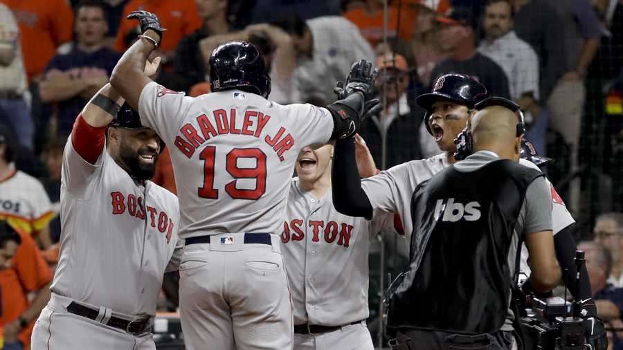 Boston Red Sox's Jackie Bradley Jr. celebrates after his grand slam against the Houston Astros during the eighth inning in Game 3 of a baseball American League Championship Series on Tuesday, Oct. 16, 2018, in Houston. (AP Photo/David J. Phillip)