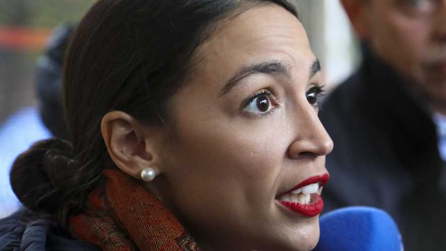 New York Democratic congressional candidate Alexandria Ocasio-Cortez speaks with reporters after voting, Tuesday Nov. 6, 2018, in the Parkchester community of the Bronx, N.Y. (AP Photo/Bebeto Matthews)