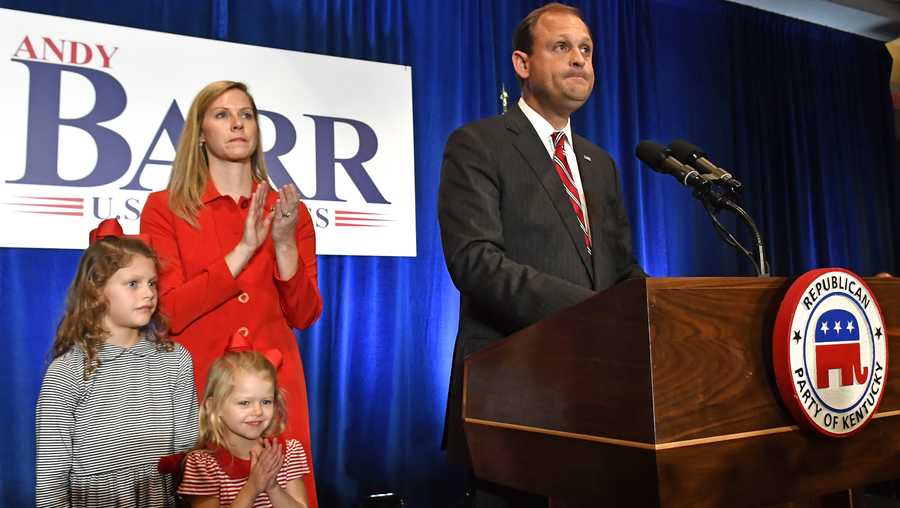 U.S. Rep. Andy Barr, R-Ky., right, with his wife Carol and daughters Eleanor and Mary Clay look out over his supporters at his victory celebration in Lexington, Ky., Tuesday, Nov. 6, 2018. (AP Photo/Timothy D. Easley)