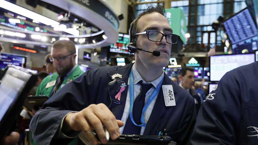 Trader Gregory Rowe works on the floor of the New York Stock Exchange, Wednesday, Nov. 28, 2018. Stocks are opening higher on Wall Street, led by solid gains in big technology and health care companies. (AP Photo/Richard Drew)