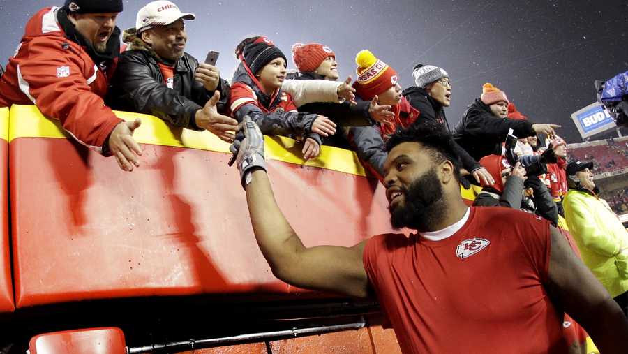 Kansas City Chiefs offensive tackle Jeff Allen celebrates with fans after an NFL divisional football playoff game against the Indianapolis Colts Saturday, Jan. 12, 2019, in Kansas City, Mo. The Chiefs won 31-13. (AP Photo/Charlie Riedel)