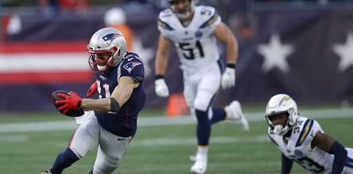 New England Patriots wide receiver Julian Edelman (11) runs after catching a pass during the second half of an NFL divisional playoff football game, Sunday, Jan. 13, 2019, in Foxborough, Mass.