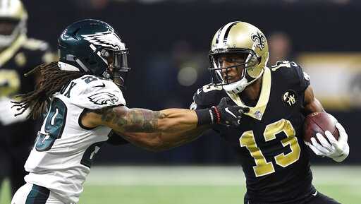 New Orleans Saints wide receiver Michael Thomas (13) carries on a 42-yard reception against Philadelphia Eagles free safety Avonte Maddox (29) in the first half of an NFL divisional playoff football game in New Orleans, Sunday, Jan. 13, 2019.