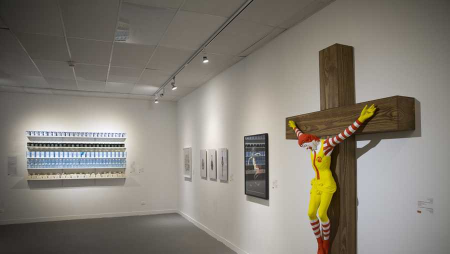 An artwork called "McJesus," which was sculpted by Finnish artist Jani Leinonen and depicts a crucified Ronald McDonald, is seen on display as part of the Haifa museum's "Sacred Goods" exhibit, in Haifa, Israel, Monday, Jan. 14, 2019. Hundreds of Christians calling for the sculpture's removal protested at the museum last week. (AP Photo/Oded Balilty)
