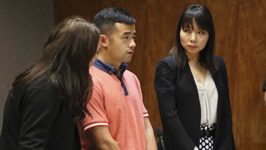 Yu Wei Gong, center, appears in court in Honolulu on Monday, Jan. 14, 2019, accompanied by his attorney, Darcia Forester, left, and Mandarin Chinese language interpreter on the right. Gong, who admitted to killing and dismembering his mother during an argument in their Honolulu apartment, has been sentenced to 30 years in prison. (AP Photo/Jennifer Sinco Kelleher)