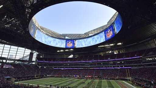 In this Sunday, Dec. 2, 2018, photo, the Atlanta Falcons play the Baltimore Ravens in the Mercedes-Benz Stadium during the second half of an NFL football game, in Atlanta. Atlanta leaders, police and federal officials plan to discuss public safety plans ahead of Super Bowl 53.