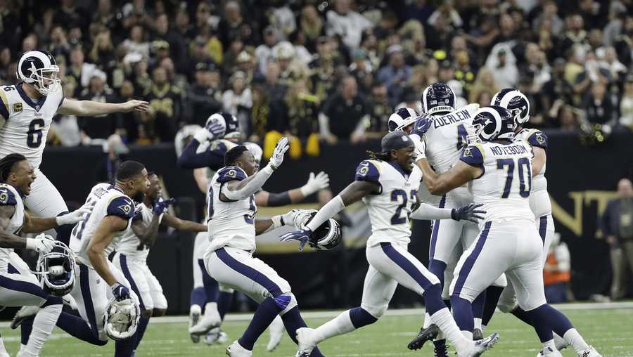 Los Angeles Rams players celebrate after overtime of the NFL football NFC championship game against the New Orleans Saints, Sunday, Jan. 20, 2019, in New Orleans. (AP Photo/David J. Phillip)