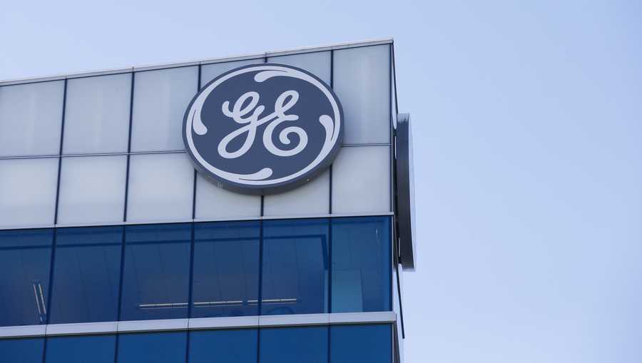 FILE- In this Jan. 16, 2018, file photo the General Electric logo is displayed at the top of their Global Operations Center in the Banks development of downtown Cincinnati. General Electric Co. reports financial results Thursday, Jan. 31, 2019. (AP Photo/John Minchillo, File)