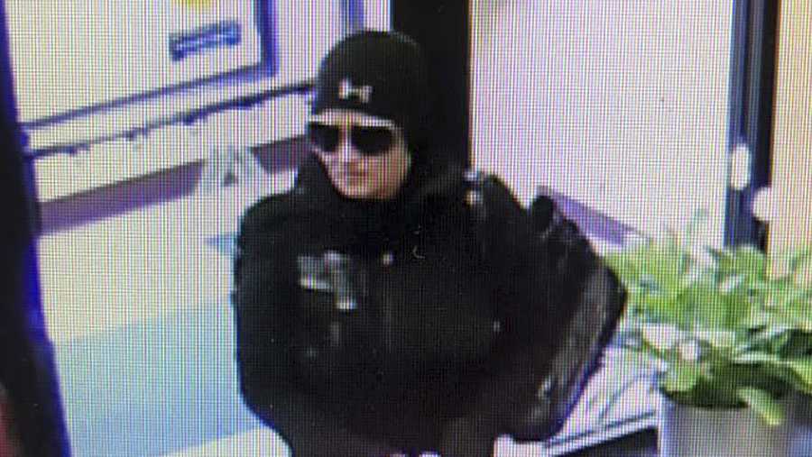 This Monday, Jan. 28, 2019 surveillance image released by the Fall River, Mass., Police Department on its Facebook page shows a female suspect in an attempted robbery of the Fall River Municipal Credit Union, who got cold feet and left without a penny. The police are looking for the suspect. (Fall River Police Department via AP)